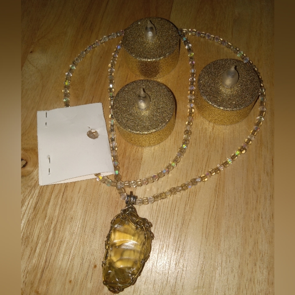 Quartz crystal emblem on a beaded necklace.